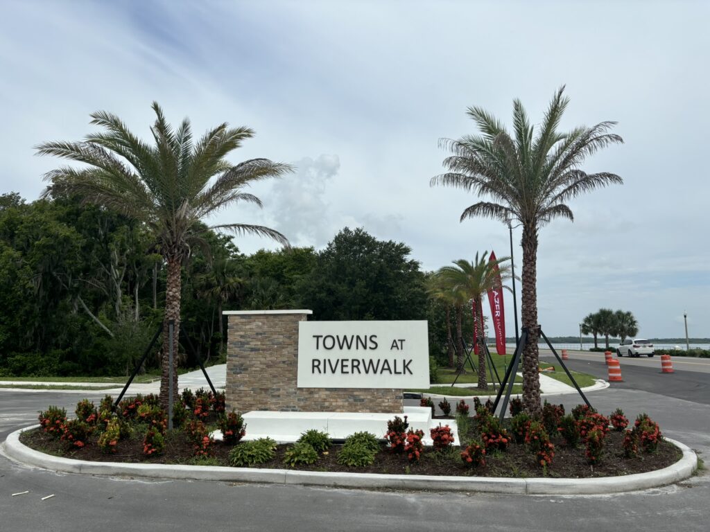 Built Towns at Riverwalk entrance monument