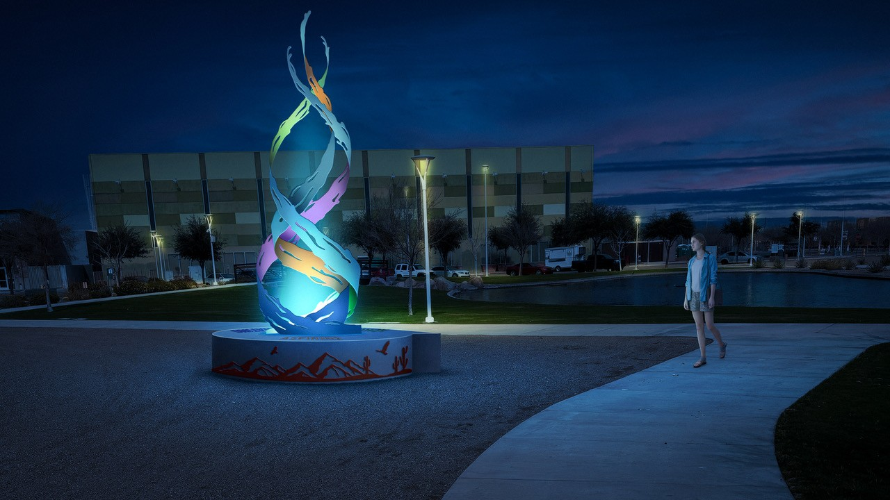 The Flame sculpture lit at night