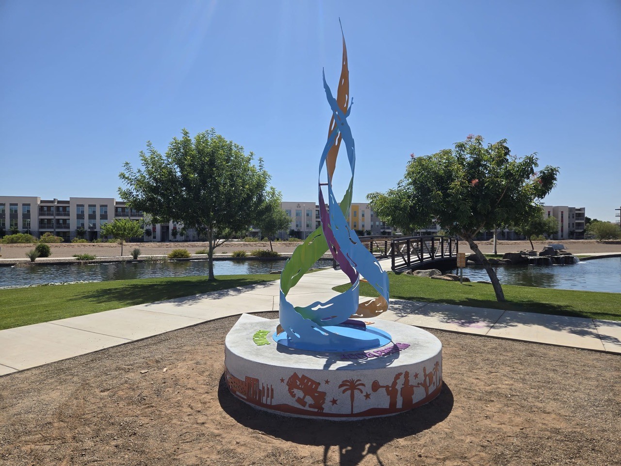 The Flame sculpture by the lake in Avondale